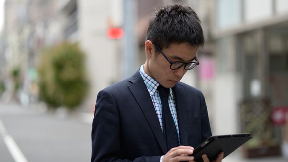 A man looking at a tablet
