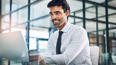 young-businessman-working-on-computer young-businessman-working-on-computer