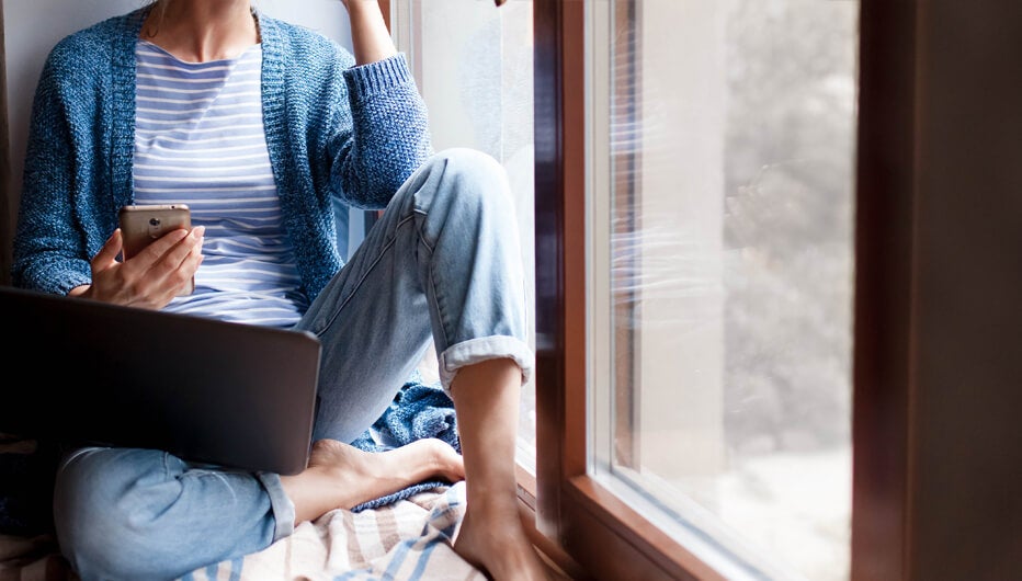 woman sitting at window