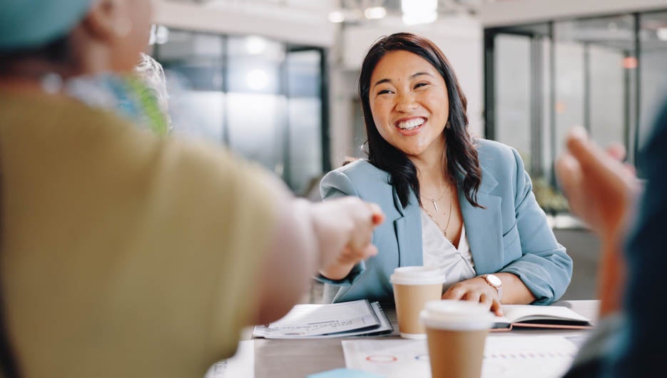 Business woman, handshake and success in onboarding, meeting and applause for hiring agreement or partnership. Contract, deal and congratulations for recruitment of Asian employee in office with HR.