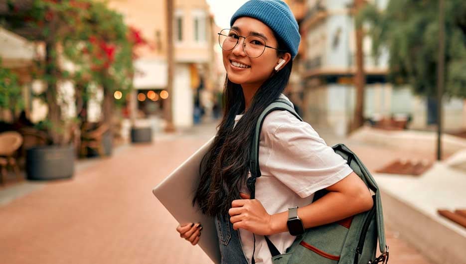 Asian female tourist student on city streets